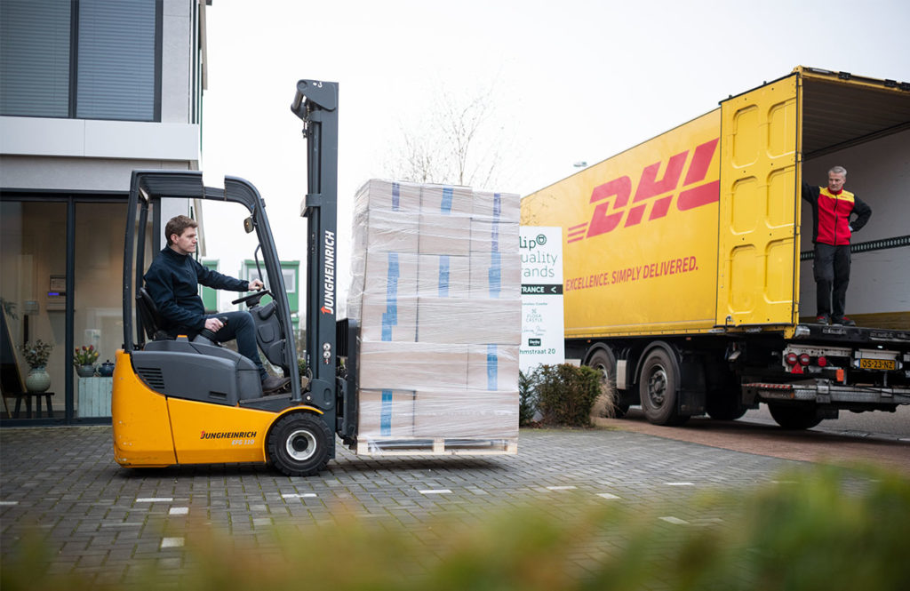 Storing packages on a DHL delivery van. 