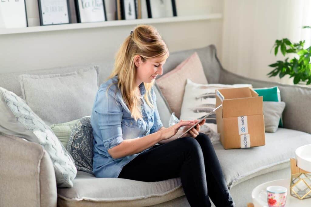Woman returning holiday gift during peak shipping season with a convenient self-service package returns portal