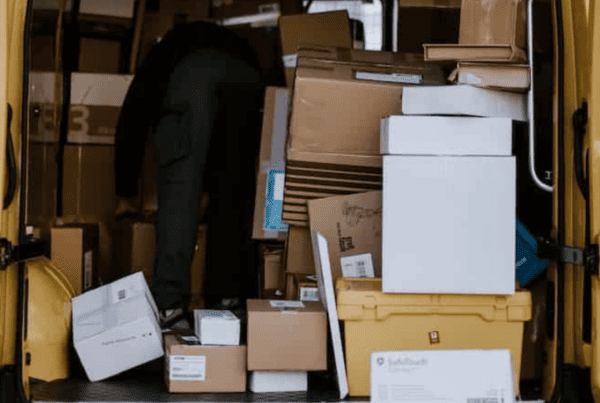 Packages piled in delivery van after peak season shipping delays