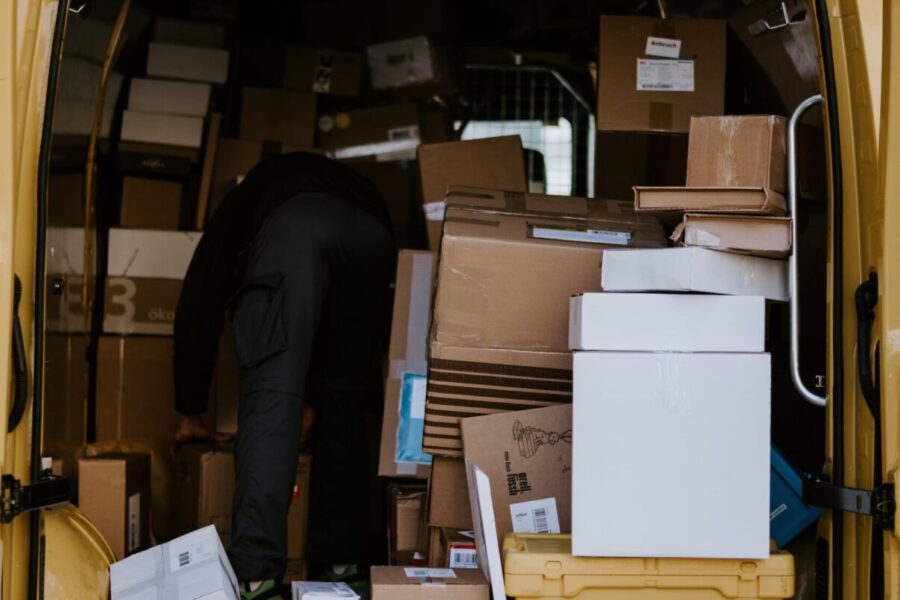 Packages piled in delivery van after peak season shipping delays