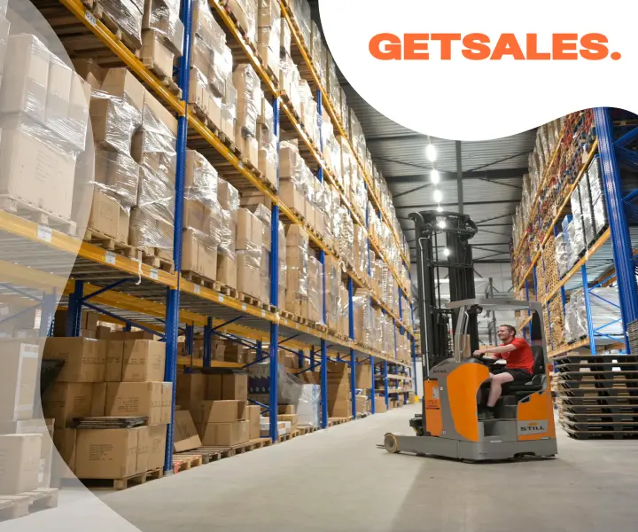 Warehouse with high shelves filled with boxes and a worker operating a forklift, GETSALES logo